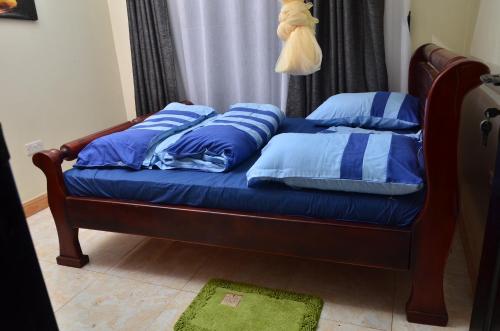 Ένα ή περισσότερα κρεβάτια σε δωμάτιο στο Seguku Homes Kampala