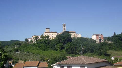 a group of buildings on top of a hill at La casetta rossa in Collicello