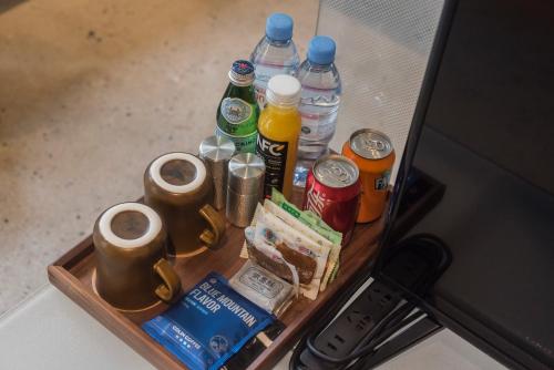 a tray with drinks and other items on a table at Shanyu Life Huangshan Design Hotel in Huangshan