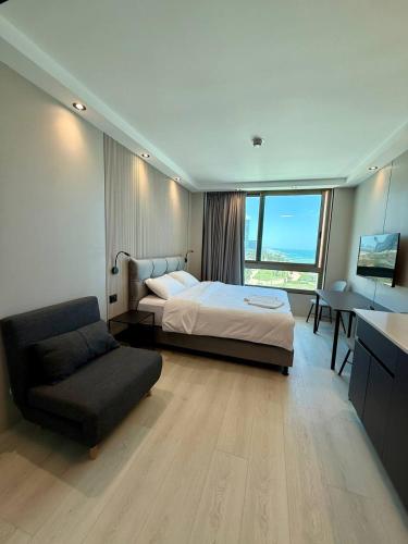 Postel nebo postele na pokoji v ubytování Carmel Holiday Apartments