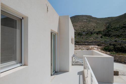 a view from the balcony of a white house at Noble 7 Suites - Adults Only - Onar Hotels Collection in Parikia