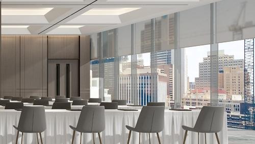 a conference room with chairs and a table with a view at Holiday Inn Shanghai Jing'an in Shanghai
