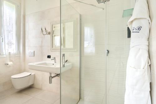 a bathroom with a shower and a sink and a toilet at Boutique Hotel San Giovanni in San Giovanni in Persiceto
