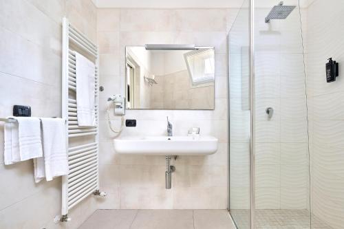 a bathroom with a sink and a shower at Boutique Hotel San Giovanni in San Giovanni in Persiceto