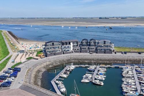 an aerial view of a marina with boats in the water at Vakantiewoning aan het strand 'Somaris' - met tuin en terras - Vista Maris - Nr 50 in Sint Annaland