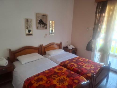Postel nebo postele na pokoji v ubytování Hotel Galini