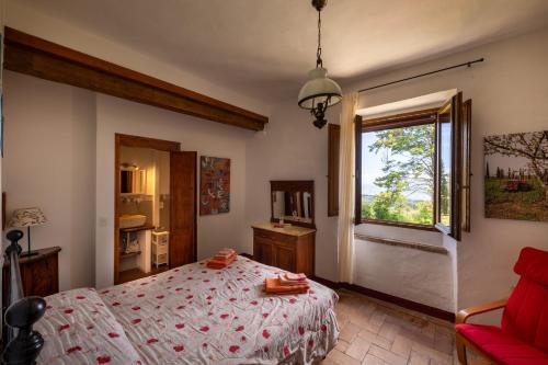 En eller flere senge i et værelse på Agriturismo Il Cocco