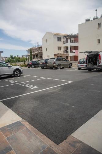 a parking lot with cars parked in a parking lot at Sea view Penthouse Universal Residences in Nea Paphos