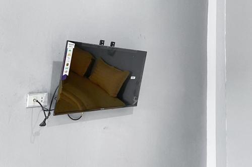 a box on a wall with a pillow in it at RedDoorz at Graha Aisyah Setiabudi Medan in Sunggal