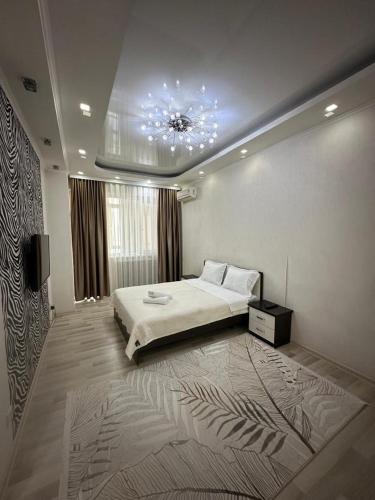 Postel nebo postele na pokoji v ubytování Frunze Apartment