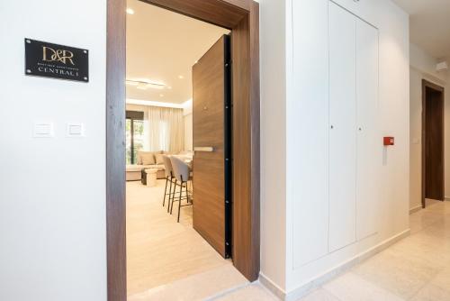 a hallway with a door leading to a dining room at D&R Boutique Apartments Central in Rhodes Town