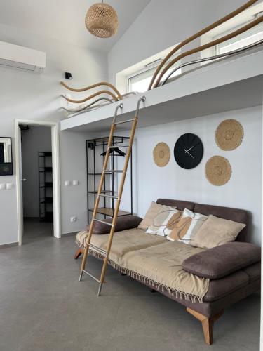 a bedroom with a bunk bed with a ladder at Slow Living House in Lozenets