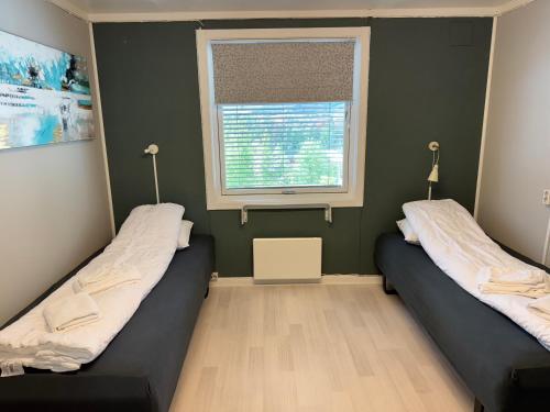 Katil atau katil-katil dalam bilik di Vinstra Hostel
