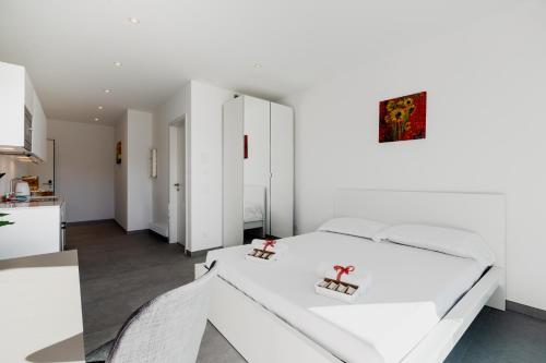 Un ou plusieurs lits dans un hébergement de l'établissement Campus Lugano 45 wonderful Smart Suites in the university area