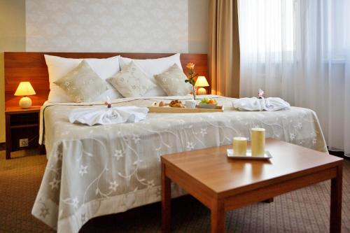 Posteľ alebo postele v izbe v ubytovaní Hotel Janosik