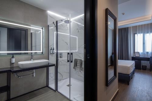 a bathroom with a shower and a sink and a tub at Leflet Sanlucar in Sanlúcar la Mayor