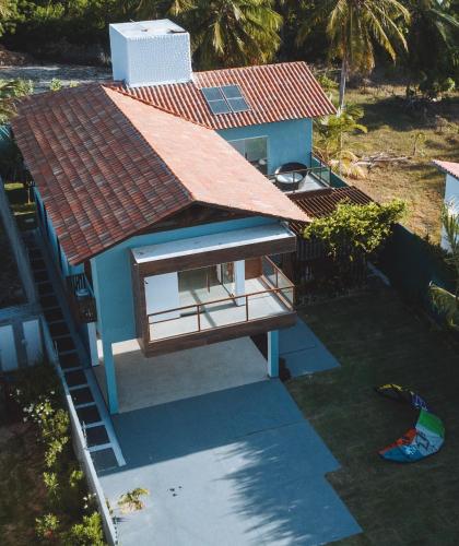 an overhead view of a house with a red roof at @Casa.Mauii - Ilha do Guajiru Luxurious House in Itarema