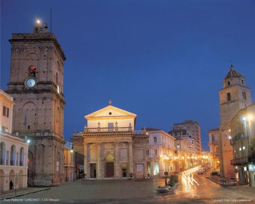a city with two tall buildings and a clock tower at Albergo Roma in Lanciano