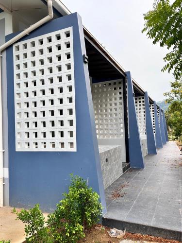 a row of blue and white gates on a building at Bluefin Hotel Lamai Beach in Lamai