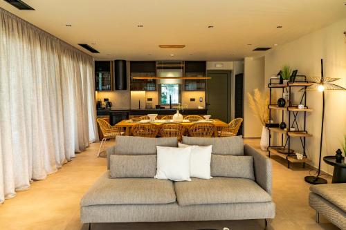 a living room with a couch and a table at Scalma Villas in Skaloma