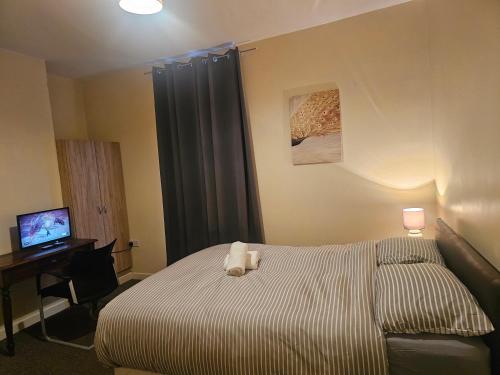 Ένα ή περισσότερα κρεβάτια σε δωμάτιο στο Rosag Guest House