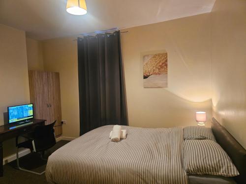 Ένα ή περισσότερα κρεβάτια σε δωμάτιο στο Rosag Guest House