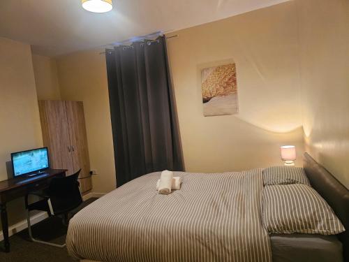 Ένα ή περισσότερα κρεβάτια σε δωμάτιο στο Rosag Guest House