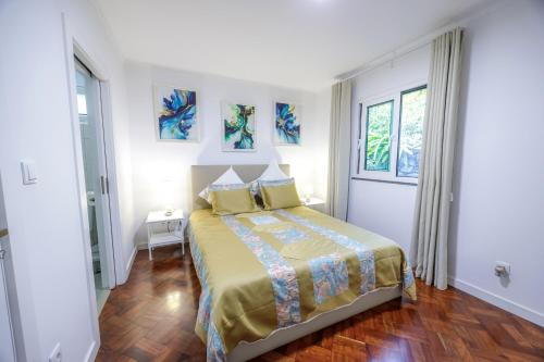 Ένα ή περισσότερα κρεβάτια σε δωμάτιο στο Casa Maravilha