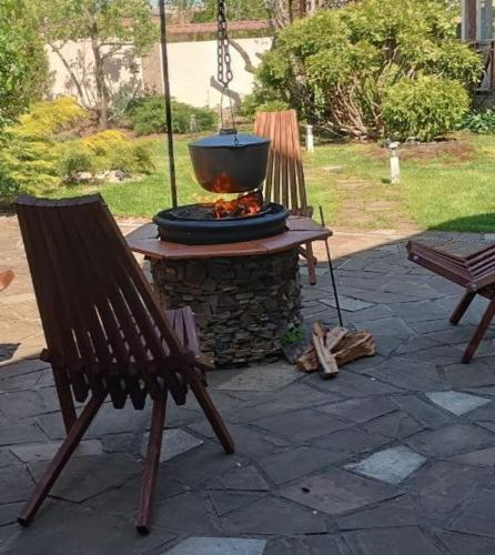 a fire pit with a pot on top of it at Загородный дом Дача in Nova Dolyna