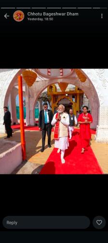 a group of people dancing on a red carpet at Karma Hostel in Khajurāho