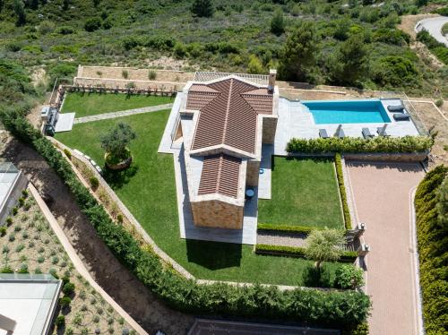 an aerial view of a house with a swimming pool at Narcissos Villa in Argostoli