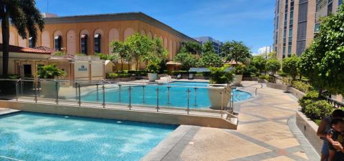 a large swimming pool in the middle of a building at The Venice Luxury Residences Condominium 28B Bellini, McKinley Hill, Taguig City, Philippines in Manila