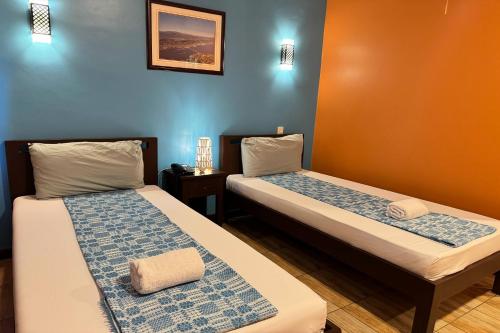 Postel nebo postele na pokoji v ubytování OveMar Resort Hotel near Vigan