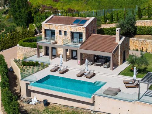 an aerial view of a house with a swimming pool at Echos Villa in Argostoli