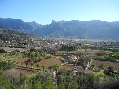 a view of a city with mountains in the background at Hotel Casa Bougainvillea in Sóller