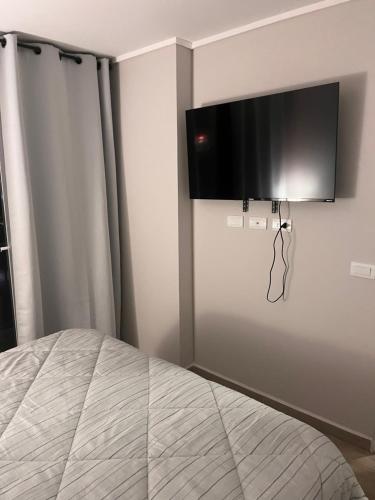 TV a/nebo společenská místnost v ubytování A pasos de Movistar Arena Depto cómodo y con increíble vista