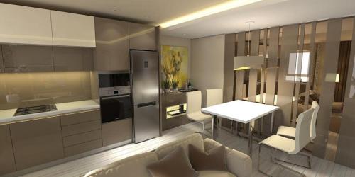 a kitchen with a table and a white table and chairs at TAN GoLD in Constanţa