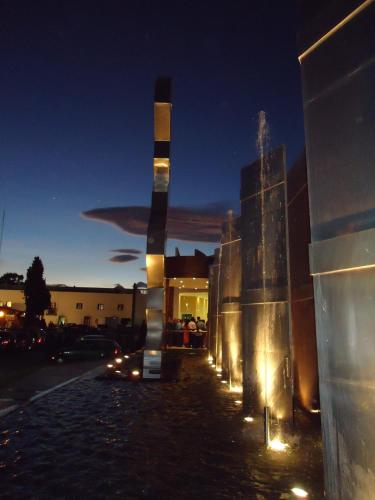 a water fountain in a city at night at Hotel Posada Señorial in Cholula