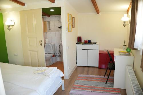 Kuchyň nebo kuchyňský kout v ubytování Communa Guesthouse