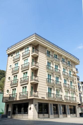 a large building with balconies on the side of it at Şişli Luxury K Suites Hotel in Istanbul