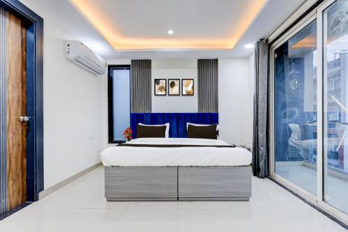 a bedroom with a large bed in a room at The Byke Business Hotel - Sector 29 in Gurgaon