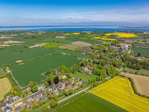 an aerial view of a village in a field at Ferienhaus Nordlicht in Steinbergkirche