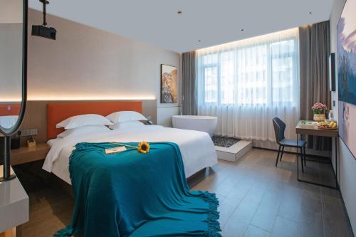Postel nebo postele na pokoji v ubytování ME Hotel