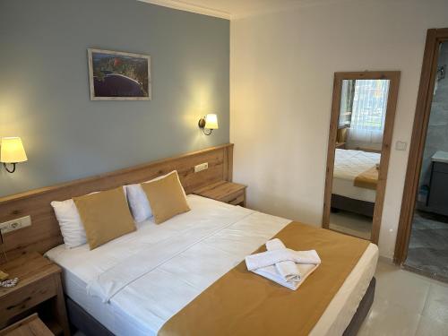 Postel nebo postele na pokoji v ubytování Katre Hotel Oludeniz