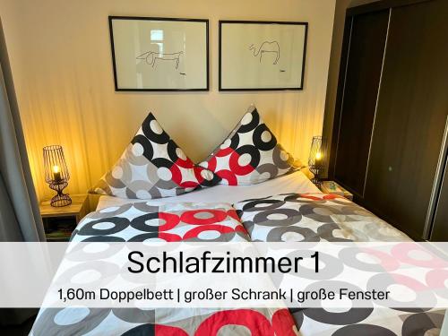 a bedroom with a bed with pillows on it at Casa-MiU am Wasser - Olburgen - perfekt für Familien - mit Freibad, Sauna, Restaurant und Spielplatz in Olburgen