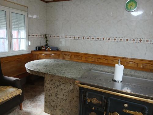 a kitchen with an island with a candle on it at Casa Pucho in Barreiros