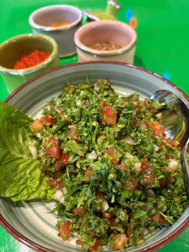 a salad in a bowl on a plate at Lacul Racilor in Olimp