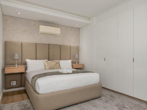 En eller flere senge i et værelse på The Warwick: Luxury secure apartment in Greenpoint