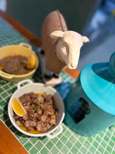 a figurine of an elephant next to a bowl of food at Lacul Racilor in Olimp