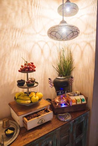 a table with fruits and other food on top of it at La Residencia Puerto Hotel & Spa in Tarifa